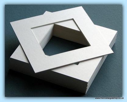 Mounts. Ivory, Size 10 x 10 Inch. Quantity  12 Mounts.